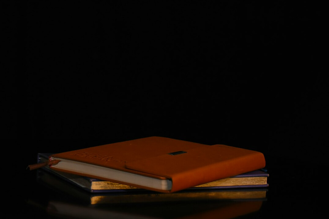 Stack of books with a warm background