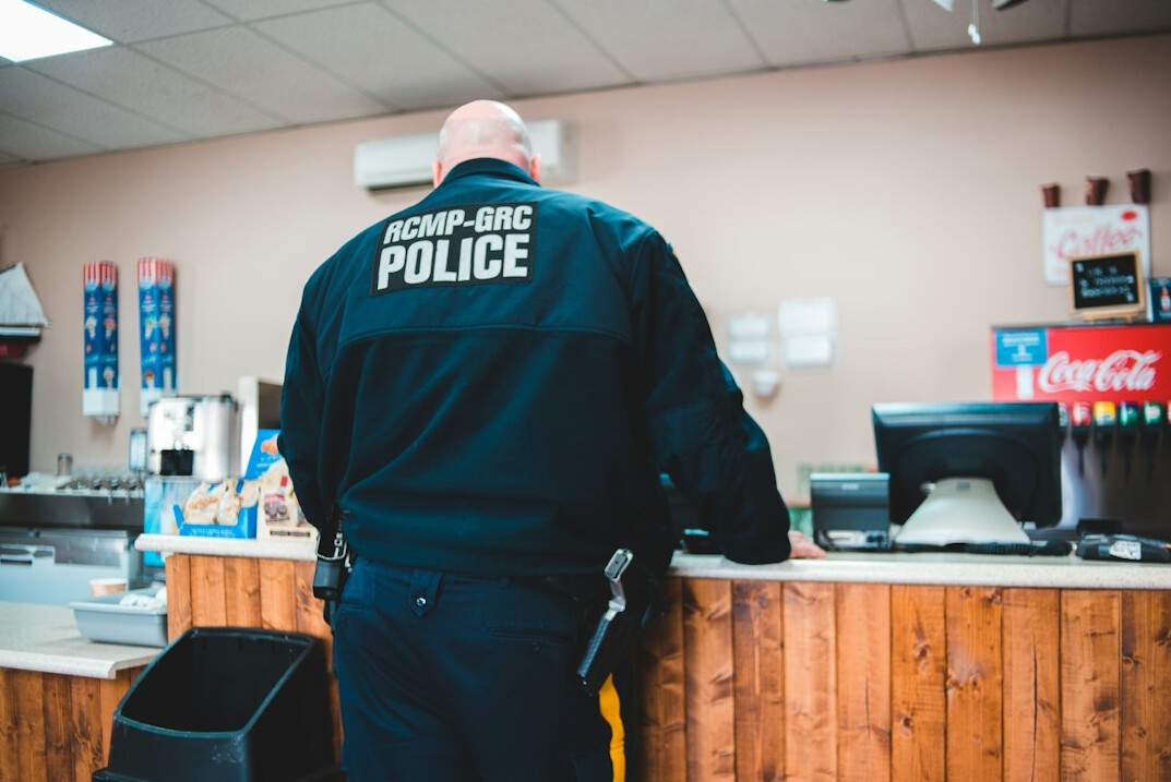 detective apprehending shoplifter