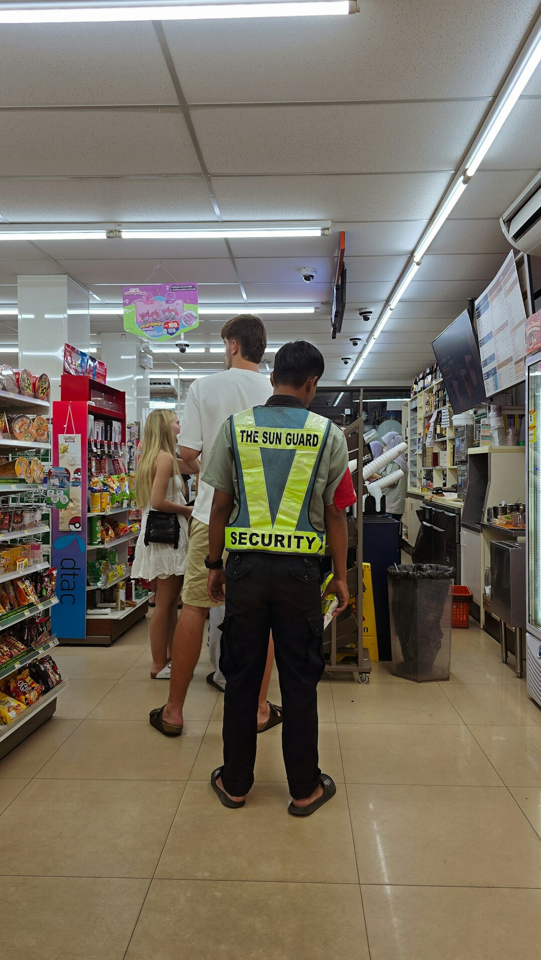 store detective monitoring aisle